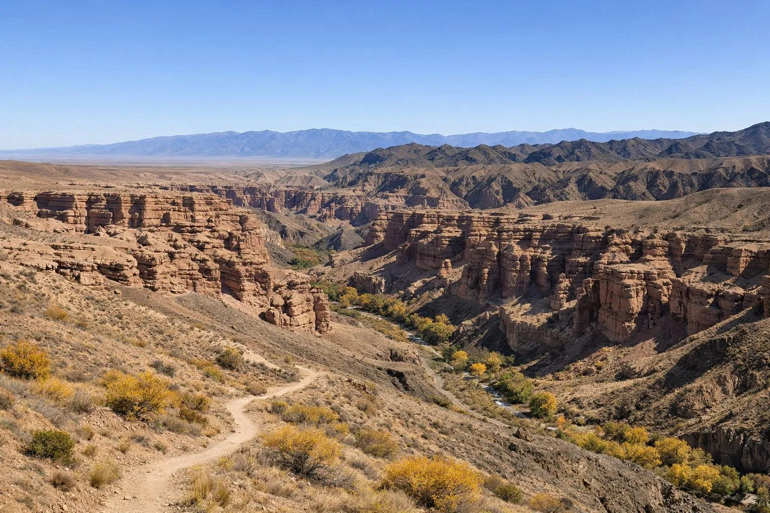 Paysage désertique montagneux avec des formations rocheuses spectaculaires.